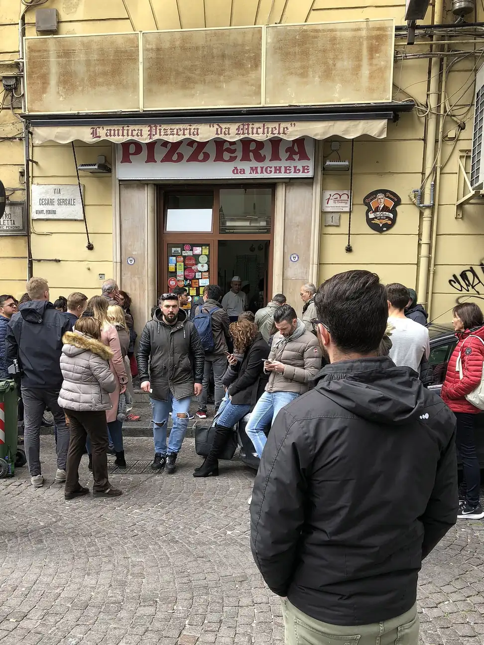 People queuing outside L'Antica Pizzeria da Michele in Naples